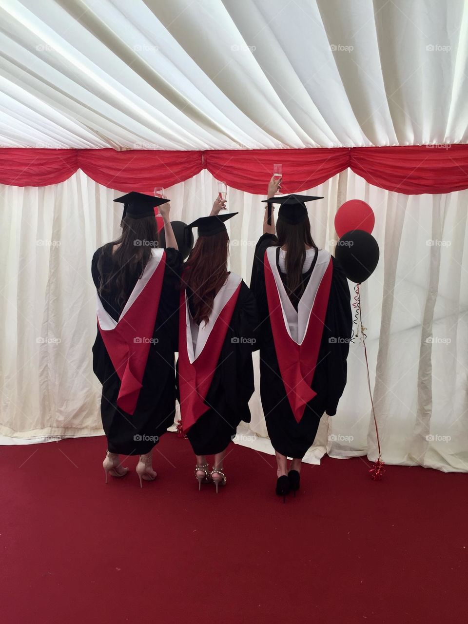 Back view of girls celebrating graduation
