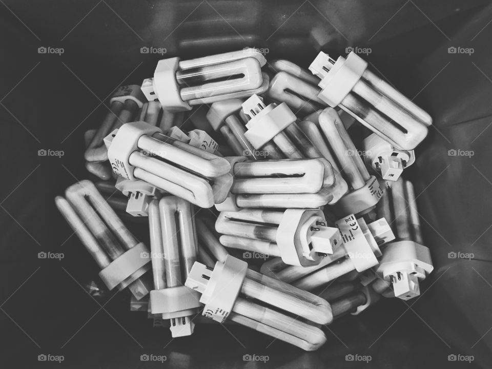 Compact fluorescent lamps in recycling bin