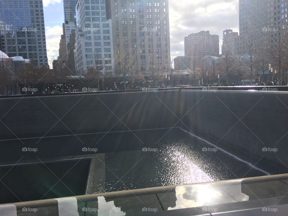 from the darkest moments come the brightest lights shining down on the World Trade Center memorial 