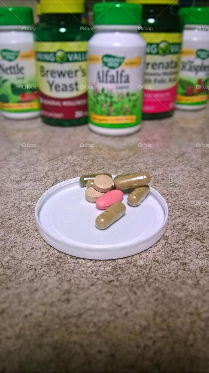 Vitamins in the morning. This is my life now, nursing while pregnant.