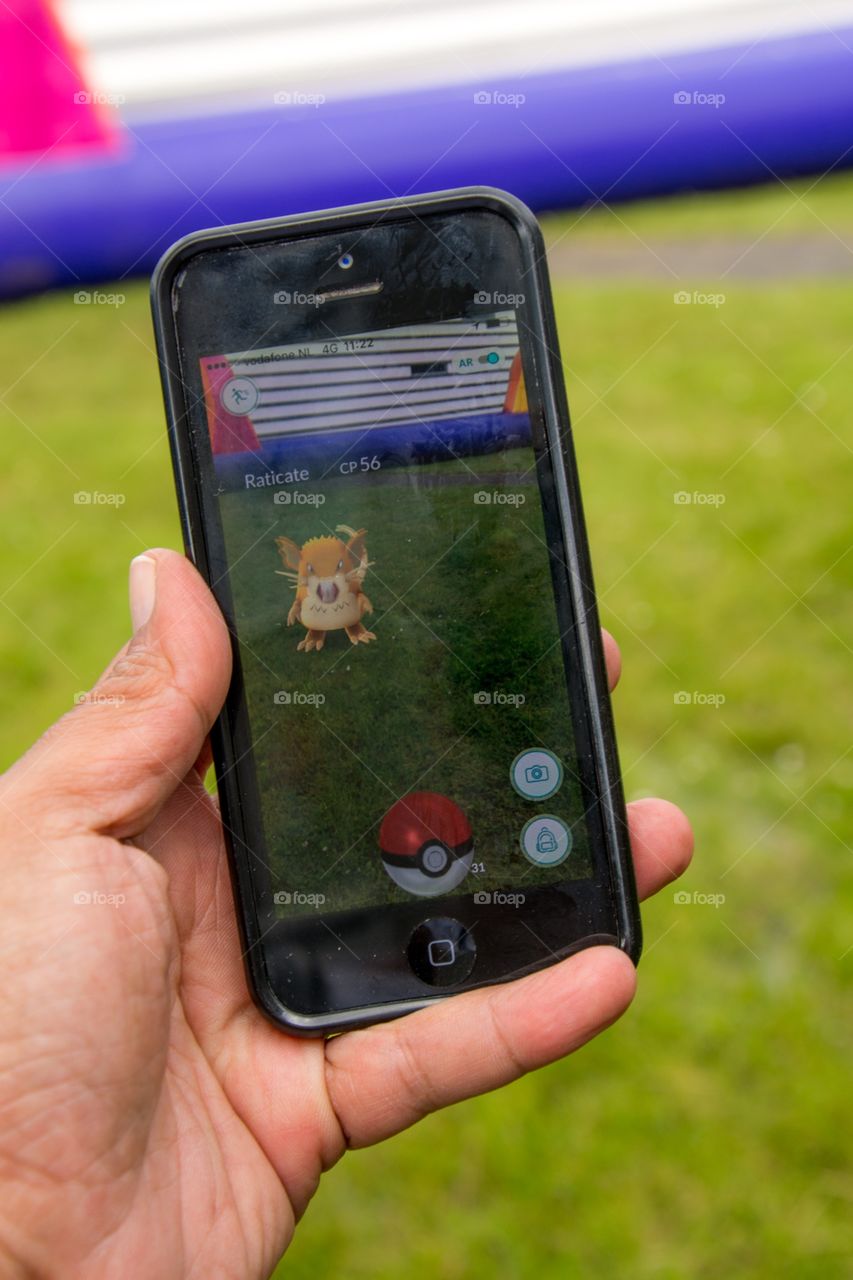 Playing Pokémon-go on a smartphone