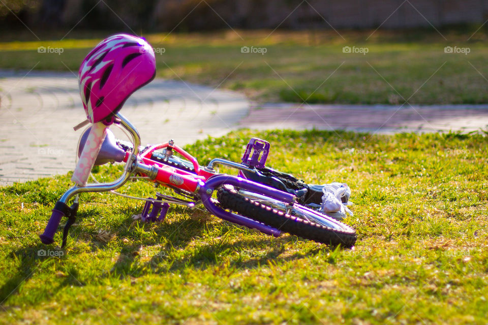 A girl's best form of transportation - a pink and purple bicycle
