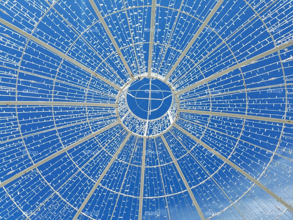 Inside of Christmas ornament made from wire and lights.