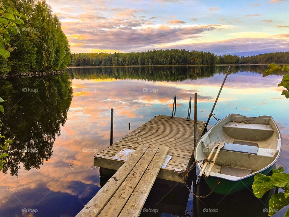 Boat moored on wooden pier