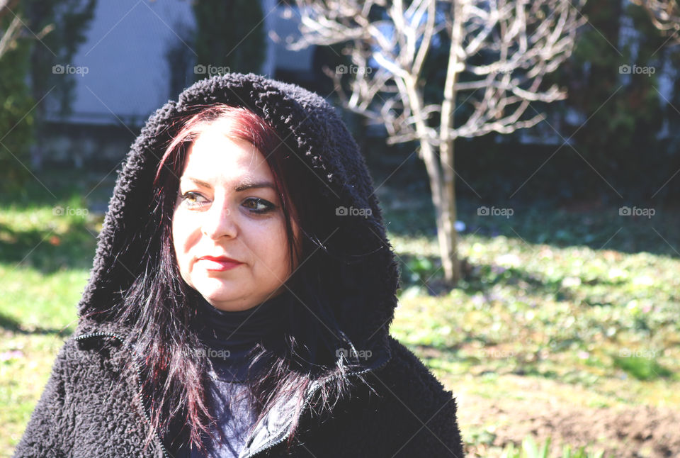 A red haired woman in the sun