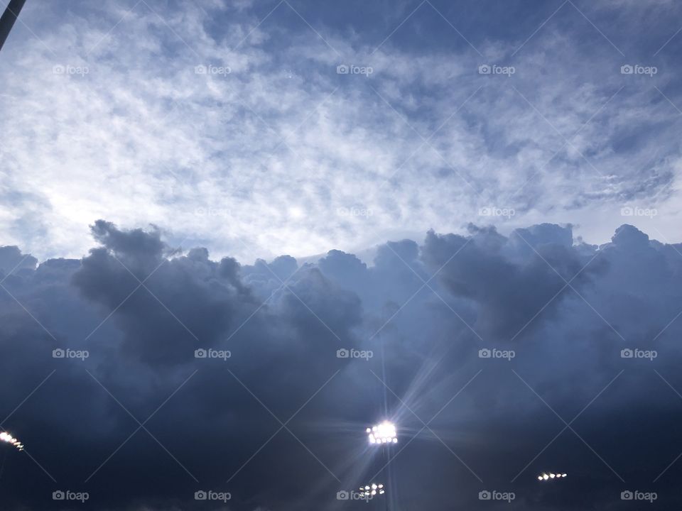 A thunderstorm coming threatening baseball