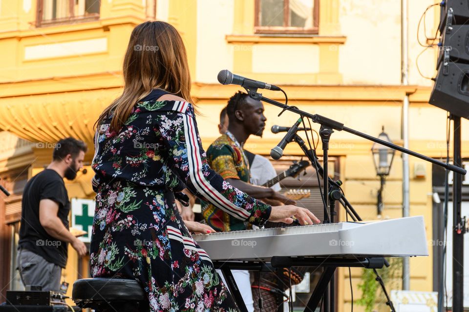 Band playing on stage in city