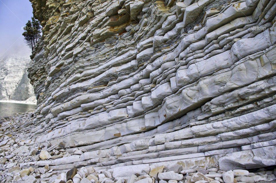 View of layered rocks on a wild beach, Gelendzhik