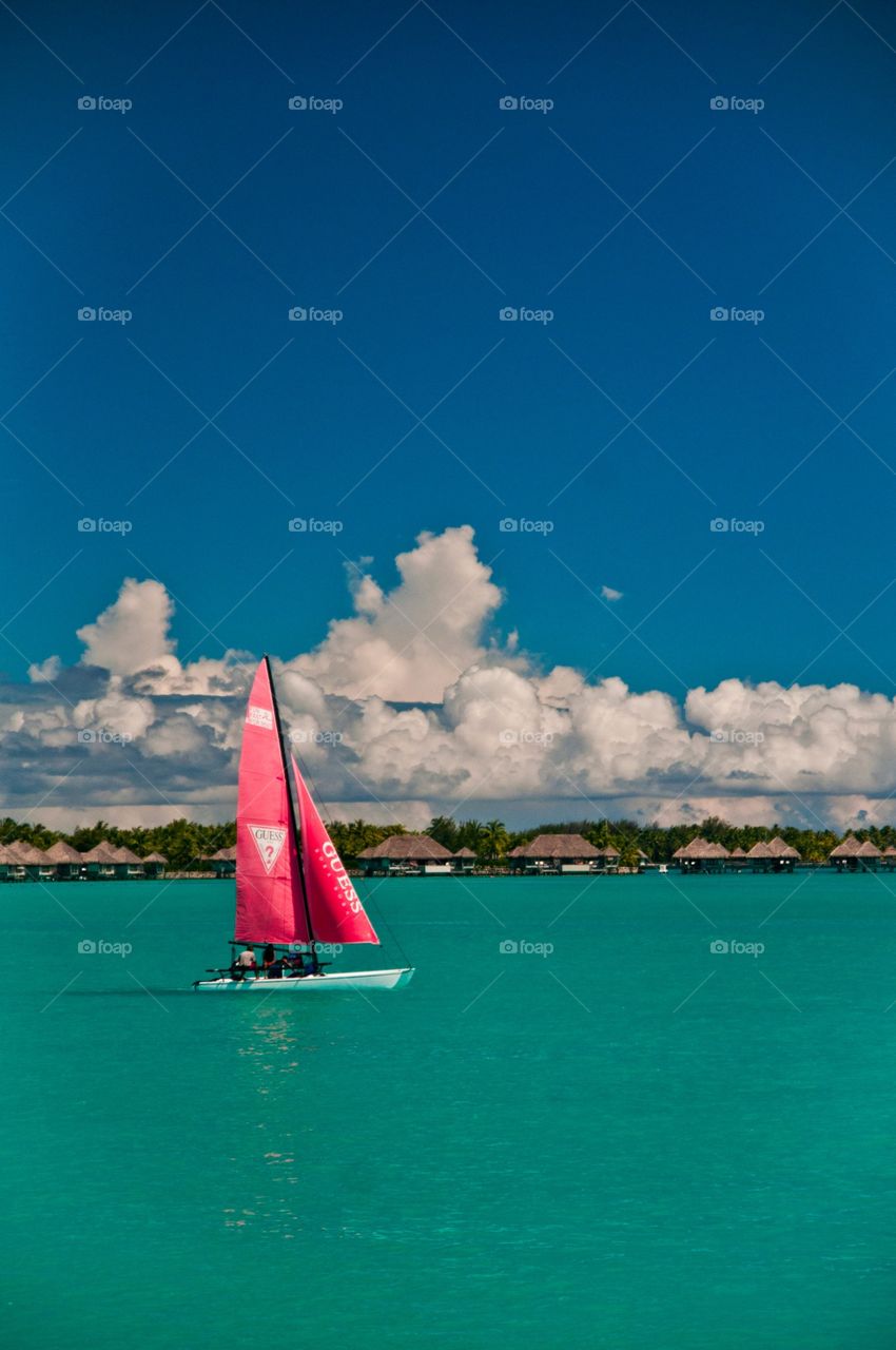 The Guess sailboat cruising around Bora Bora