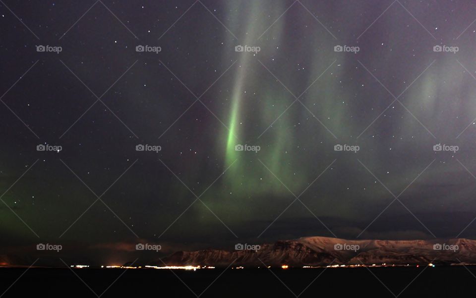 Aurora borealis in Iceland. amazing natural phenomenal. this is taken in the Reykjavik city which has strong light pollution yet the northern light still clearly visible