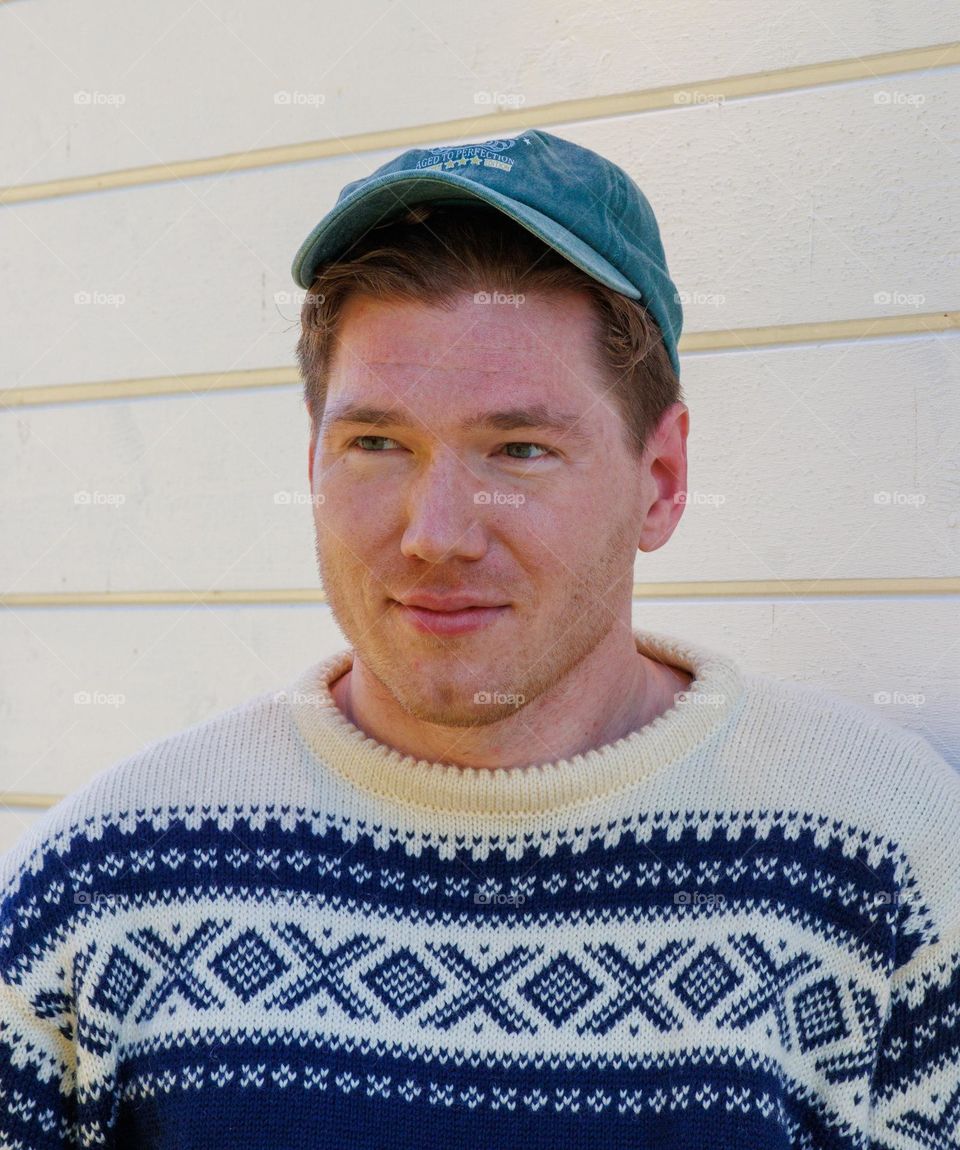 Man with knitted sweather and caps ,ready for hike into the norwegian Mountain.  Life is beautiful he thinks