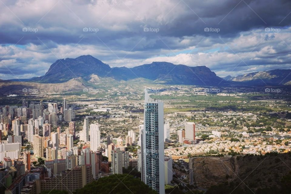 City#skyscrapper#buildings#mountain#sky#clouds#view