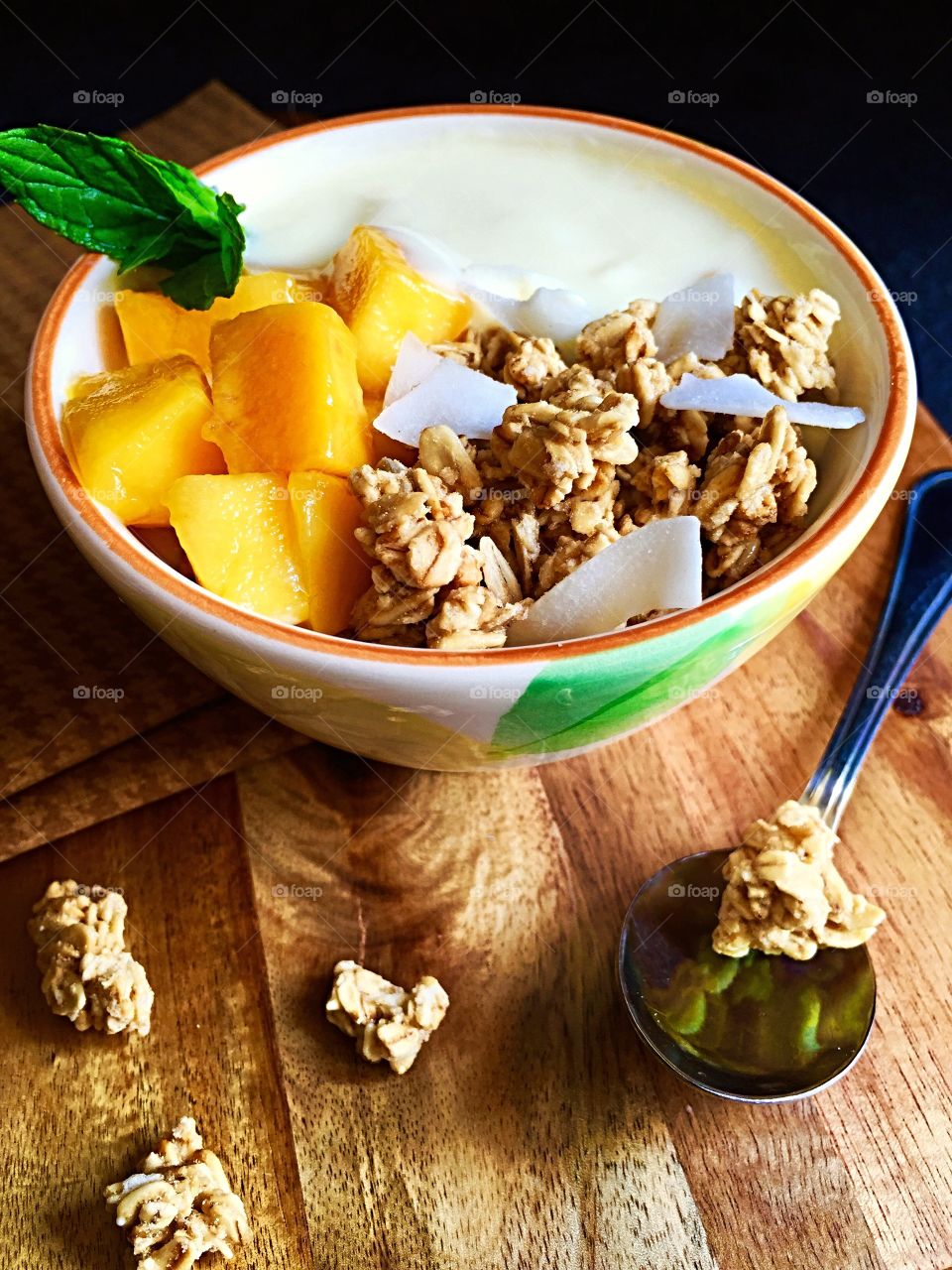 Healthy breakfast Yoghurt mango and granola 