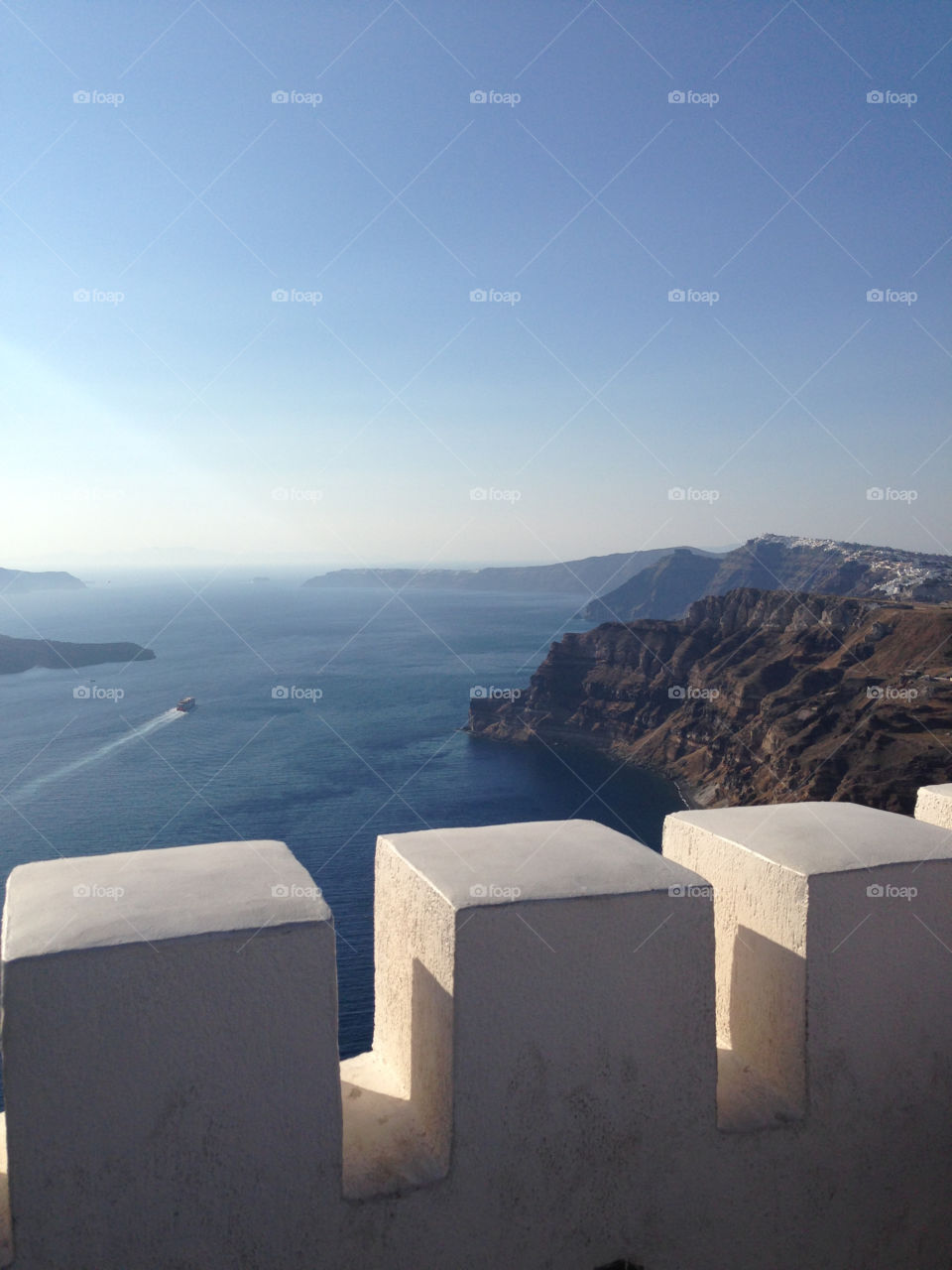 Looking over the cliffs of Santorini just before sunset