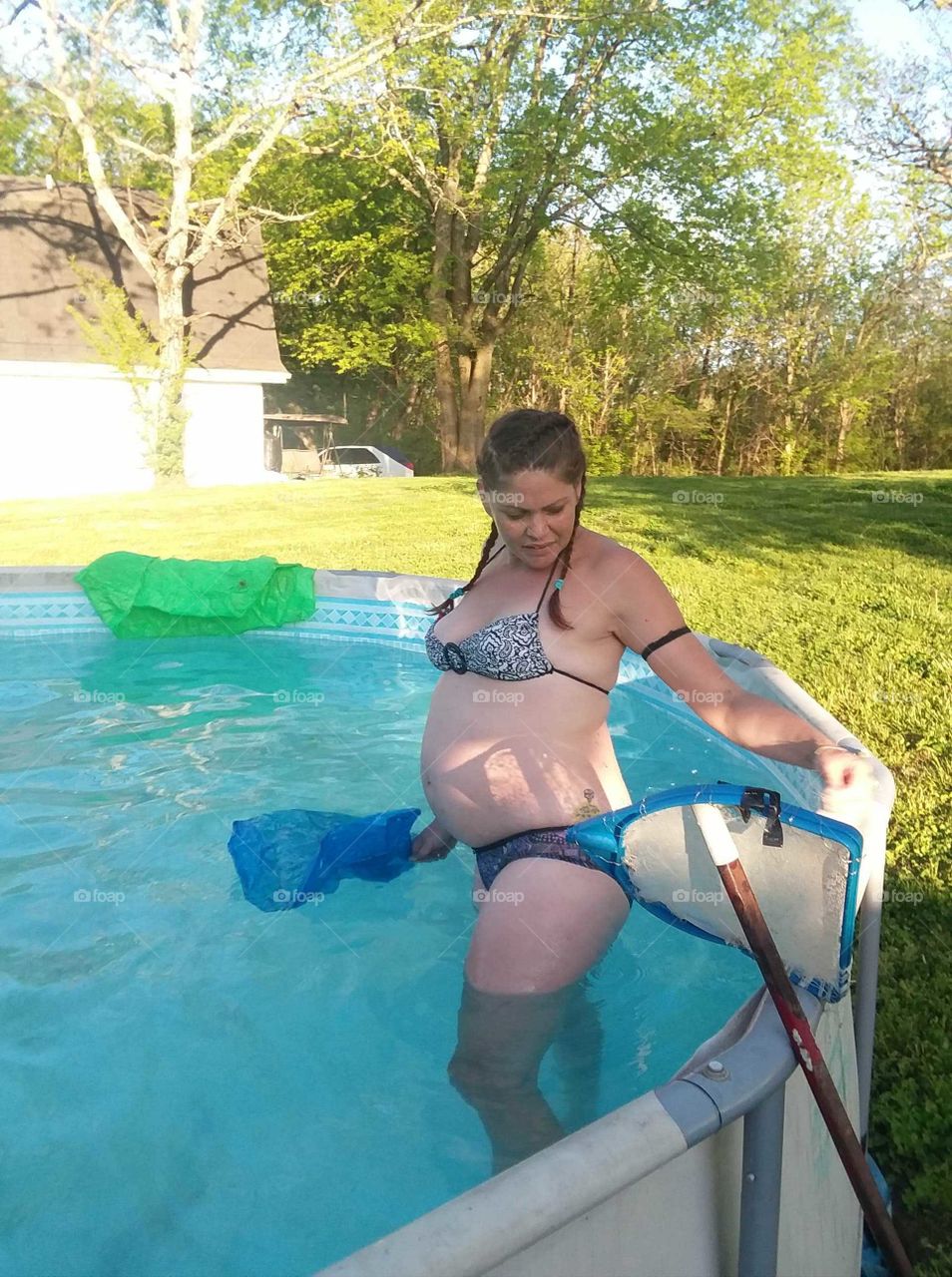8mo. pregnant with baby Damien pool time