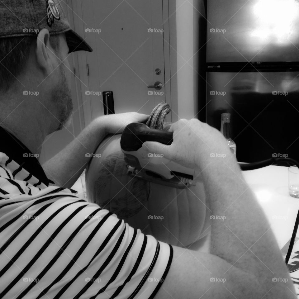 His begining to first ever pumpkin carving experience. :)