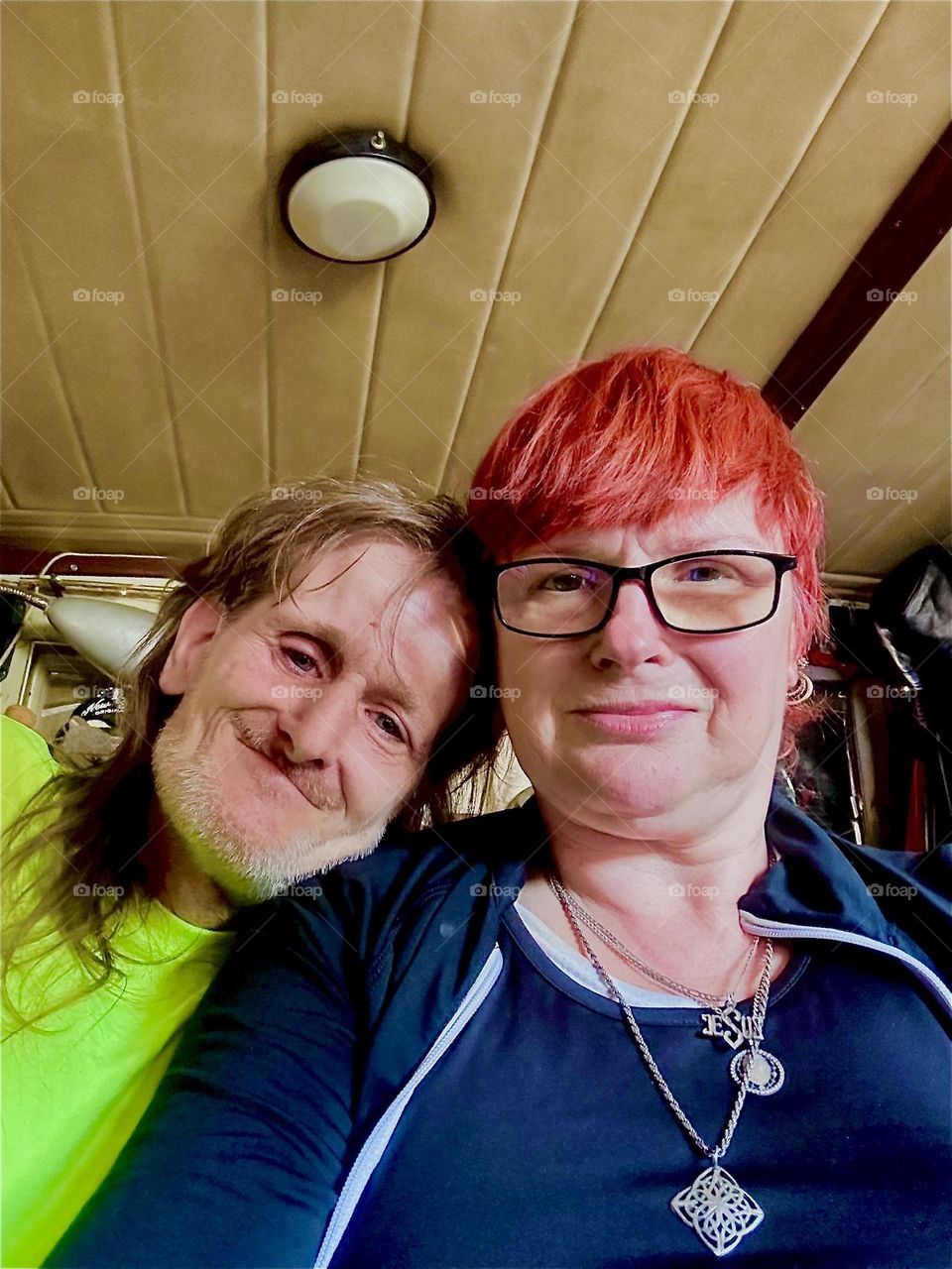 This happy couple is myself, “Petra Schiller” a.k.a. “Maxine Firefox” a.k.a. “Maximiliane Feuerfuchs” and longtime partner “Timothy Trespas” aboard “Salvation”, the “28 ft 1969 Luhrs” cabin cruiser that we call home. 2024. Hypnotic Productions