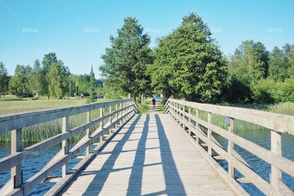 Wooden footbridge over river