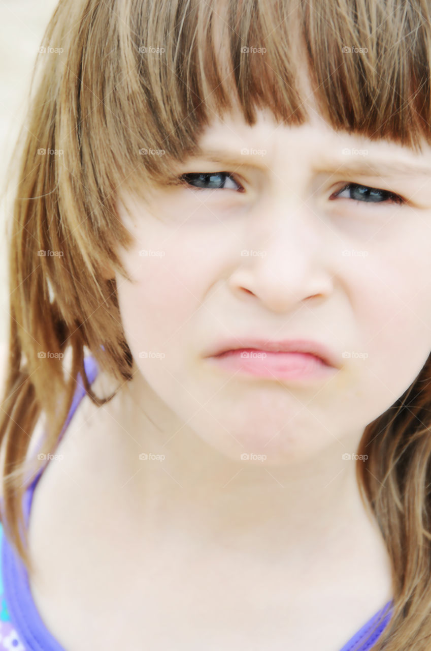 Little girl with major attitude, pouting face