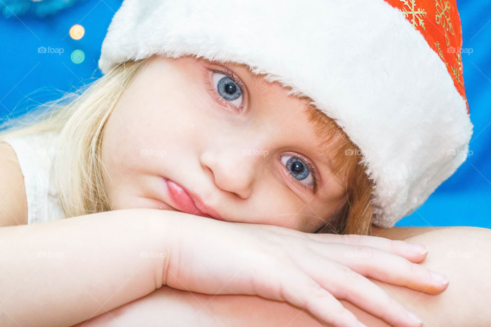 boring little girl in Santa hat