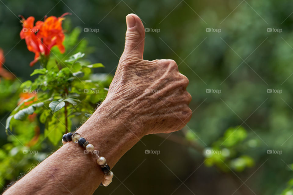 Woman's Aging finger up