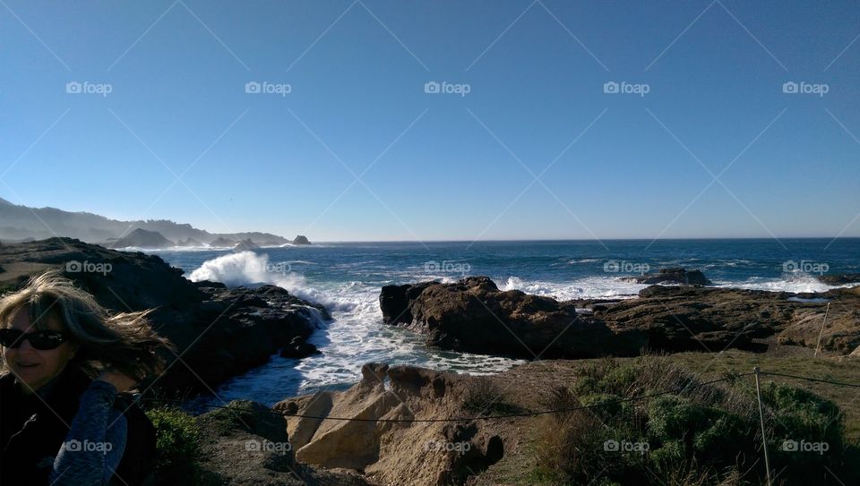 Waves splashing at rocky coastline