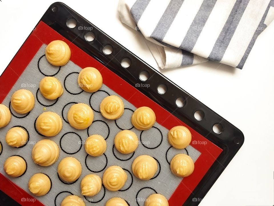 French Gougères, top view of uncooked traditional choux pastry .