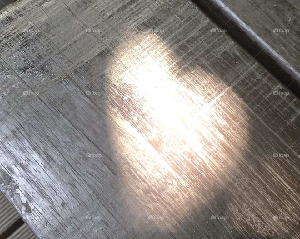 A heart shadow created by leaves