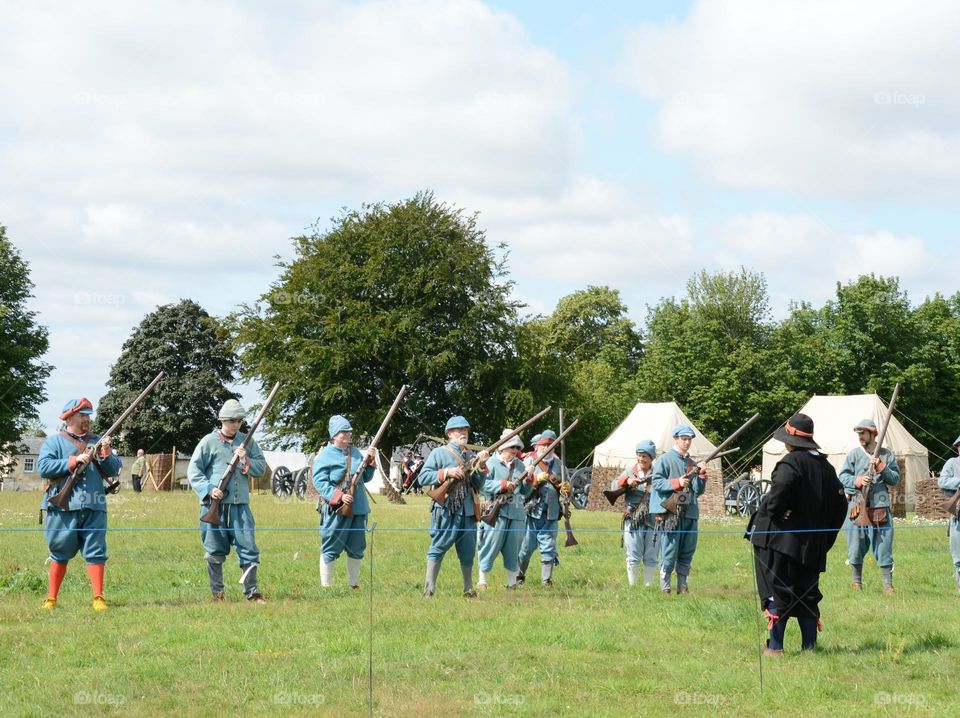 poeple dressed as Southern troups during a re-enactment of a community war