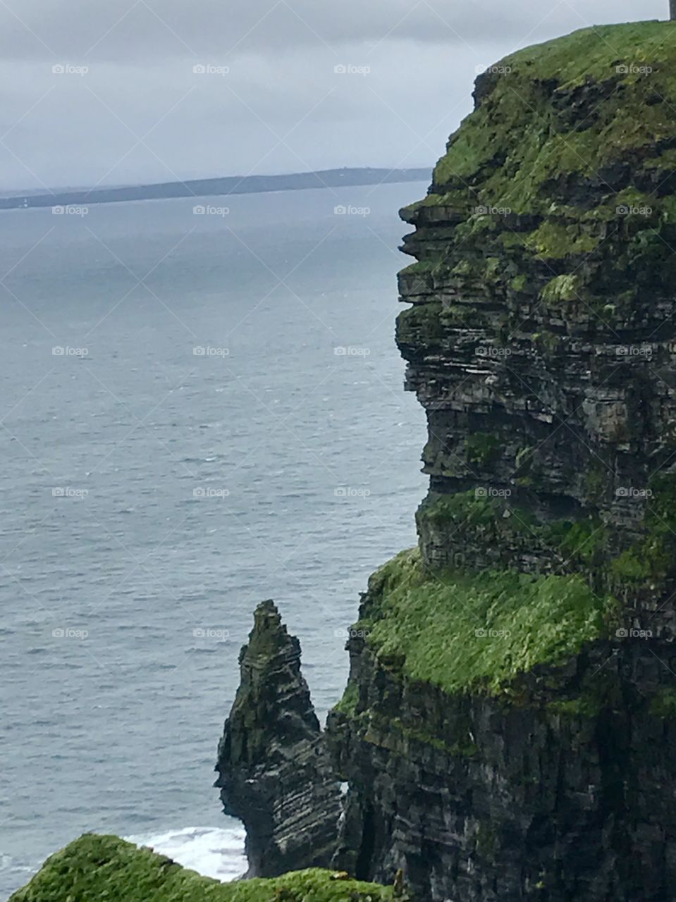 Rocky cliffs over an unrelenting sea