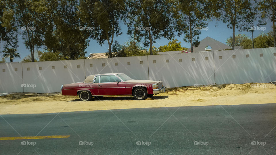 Abandoned Cadillac DeVille in Dubai