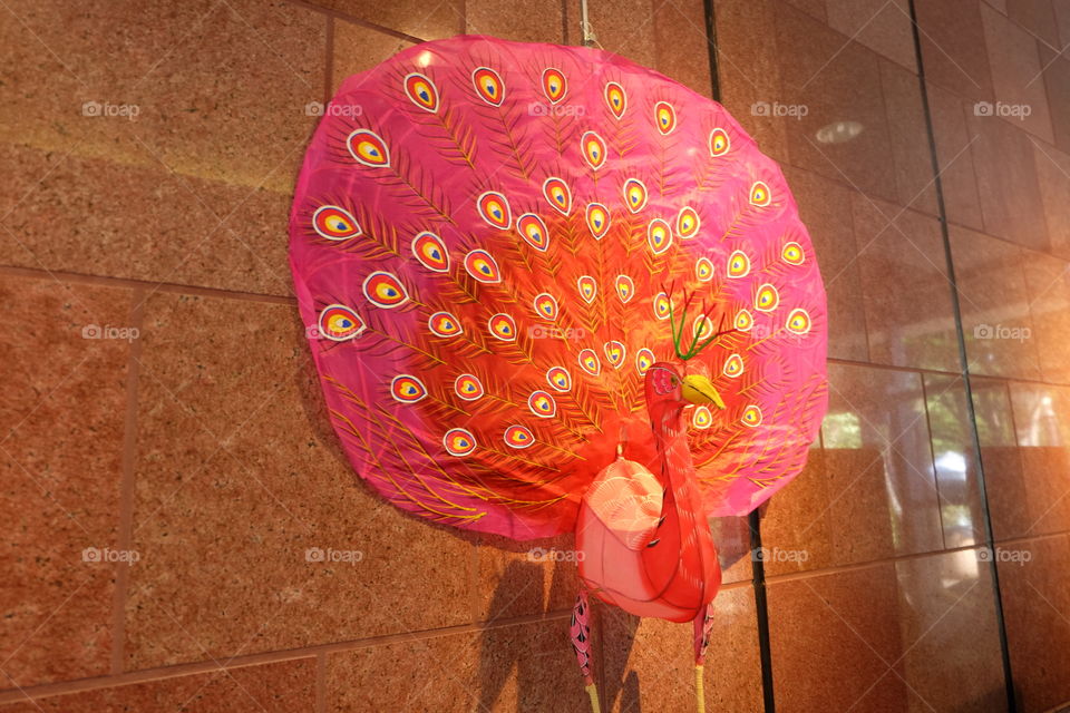 Festive decoration, red peacock