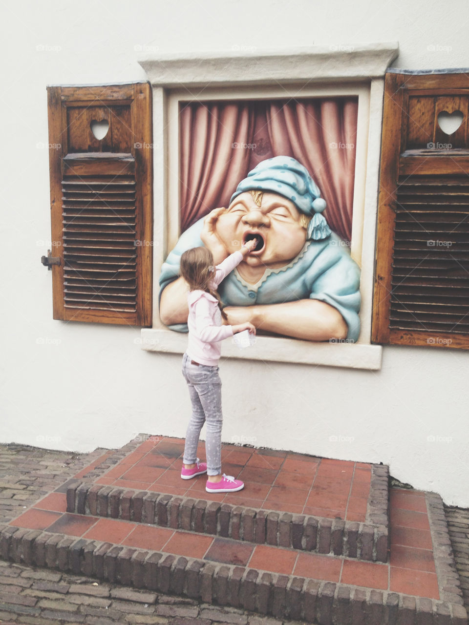 'Papier hier' in the Dutch themepark The Efteling you can throw your paper trash in the mouth of Holle Bolle Gijs. He eats it, says thank you or burps. Kids love it.