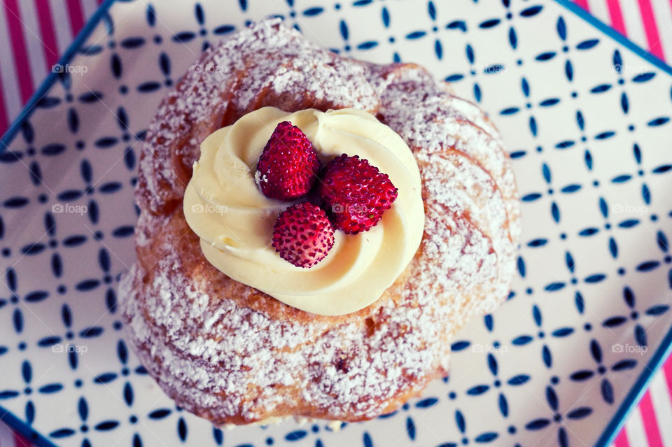 Italian dessert with strawberries and cream