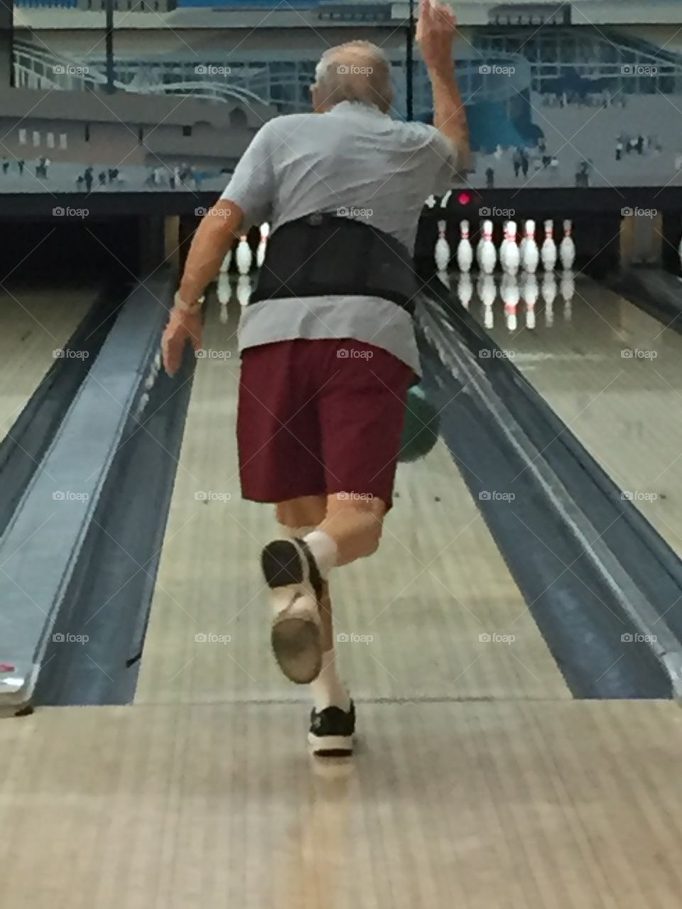 Elderly man bowling