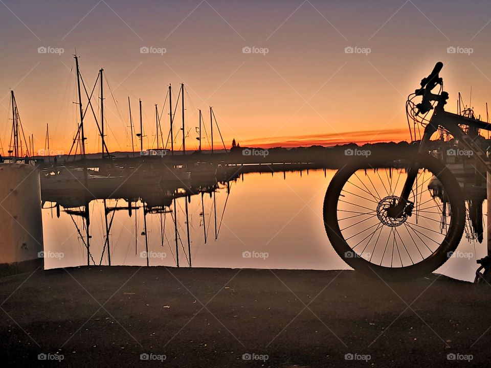 cycling along Newport coast at sunset