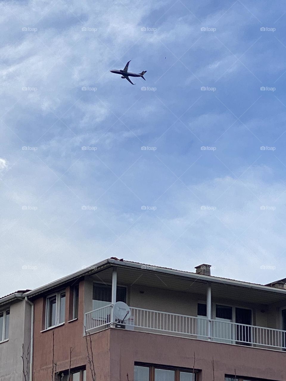 Plane over the building 