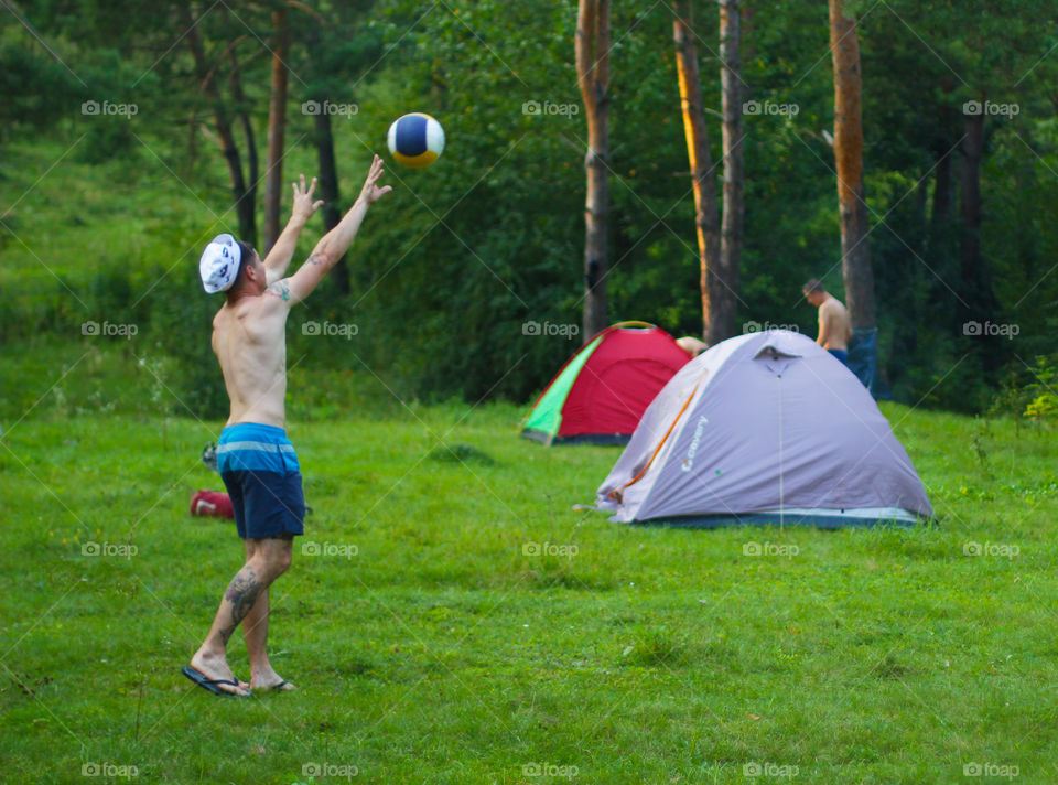 Playing volleyball in the forest