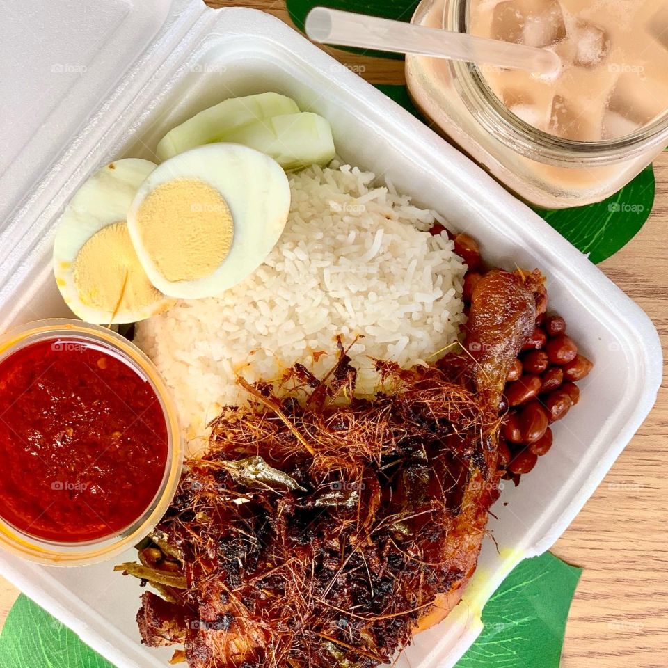 Nasi lemak ayam berempah with Teh Tarik and sambal chilli 