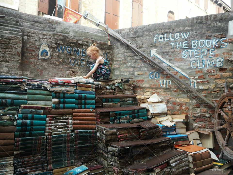 Book shopping in Libreria Acqua Alta in Venice, Italy