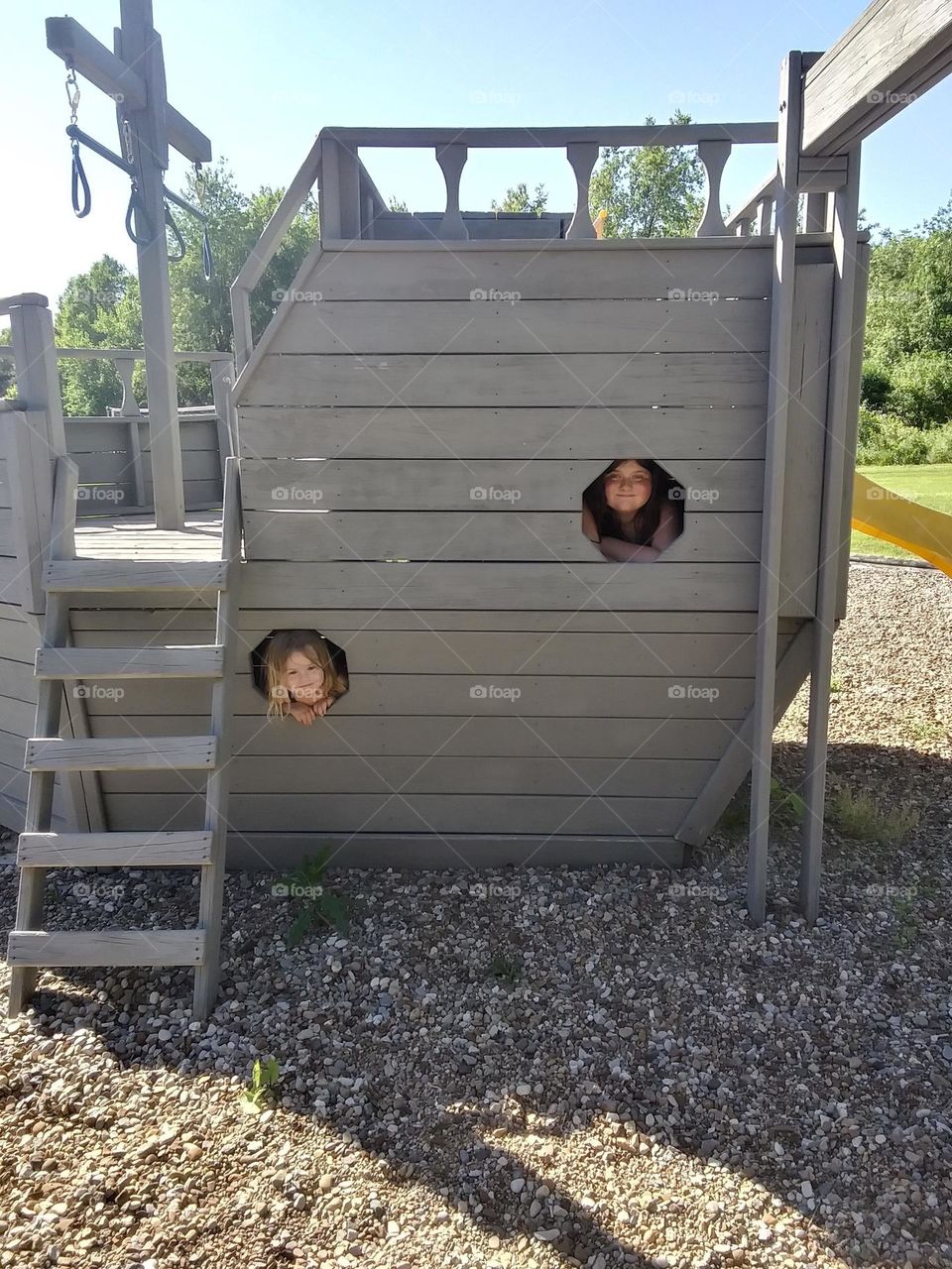 A boat shaped play set made of wood 