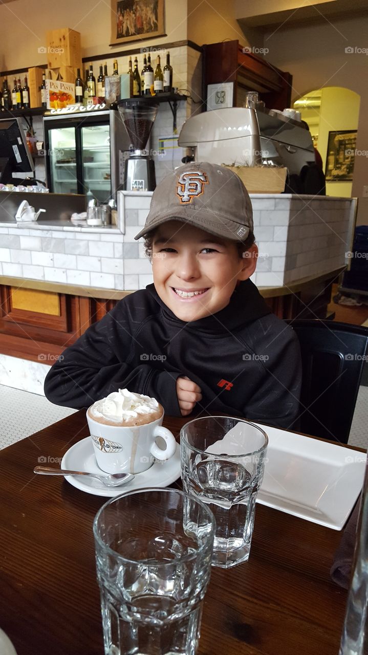 happy boy with hot chocolate