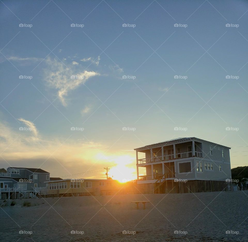 Beach front houses at sunset