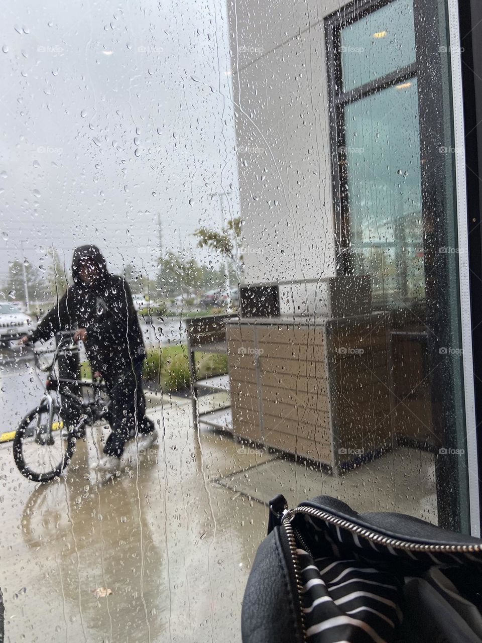 A man rides his bicycle outside a local Panera Bread restaurant on a recent rainy day. In NJ we were fortunate to only be getting much-needed rain, remnants of Hurricane Ian, which devastated Florida and South Carolina this week. Feeling grateful. 