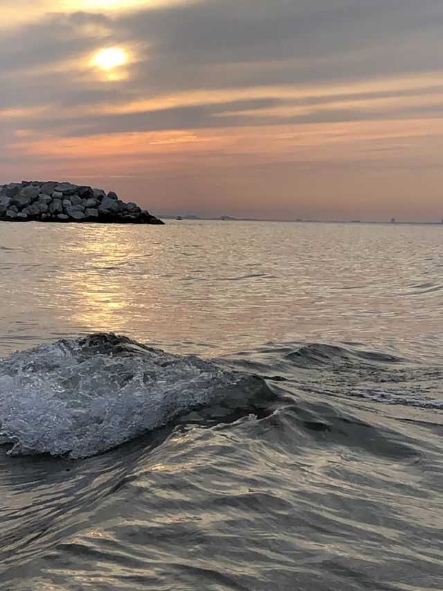 Beautiful warm summer day at the beach at sunset. A crisp cool waves with a warm breeze off Lake Michigan in Portage Indiana. 