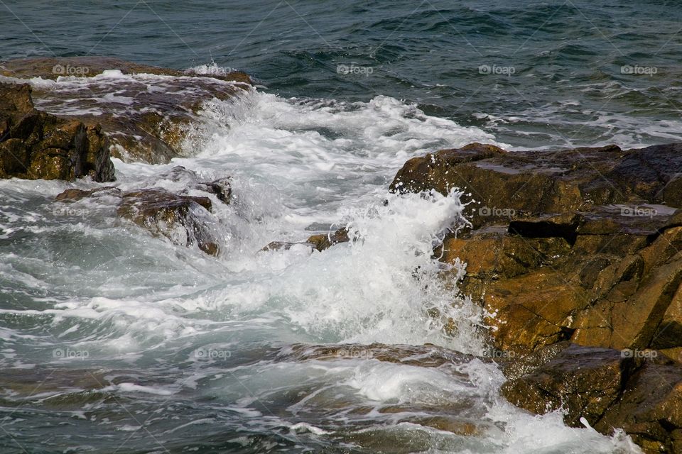waves crashing on rocks