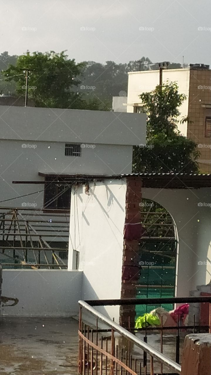 Sunshine and showers creating magic, raindrops shining in sunshine