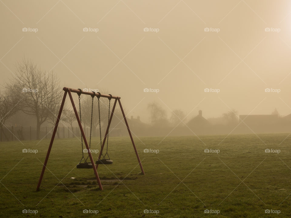 a quiet atmosphere, with a deserted swing game