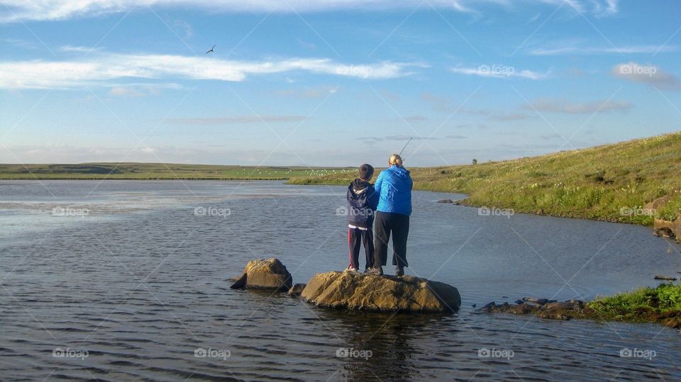 Trying to catch some fish and enjoy doing it.  A great way to spend a summer day.