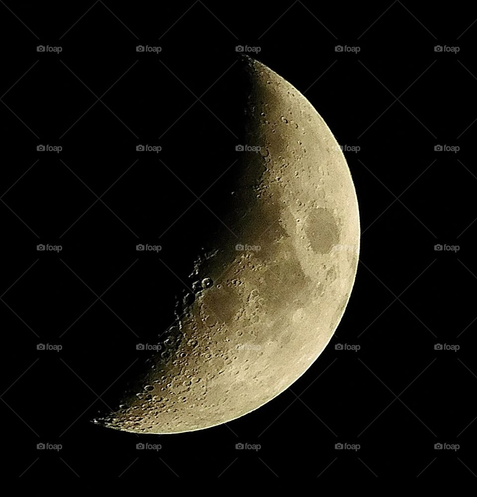 Beauty of the night - A spectacular night photograph of the moon displaying magnificent characteristics such as sun spots and craters